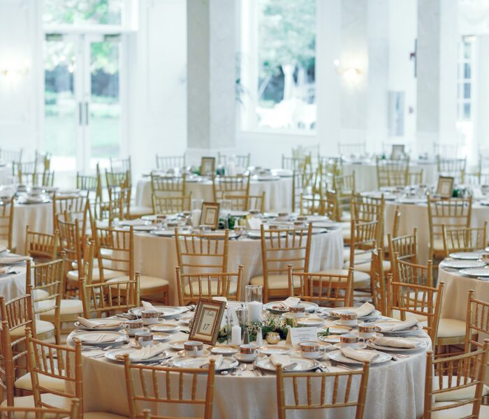 Beautiful round tables. Elegant wedding with gold furniture